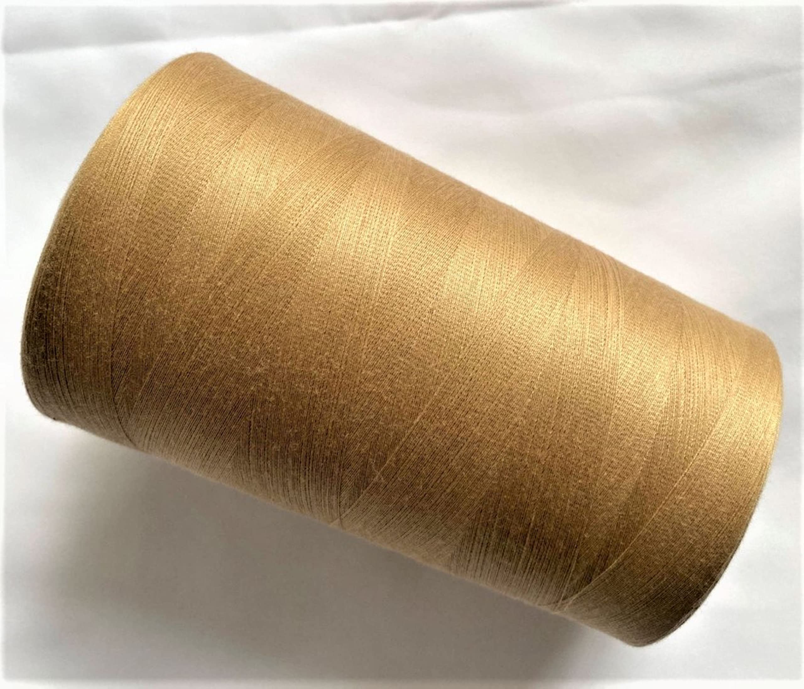 Jumbo Spool of Polyester Textured Sewing Thread fine Count for Serger / Overlock Machine 60/2 – 0.1mm Jumbo Spool Total Length : 25632 Yard. Weight: 1.1 Lbs